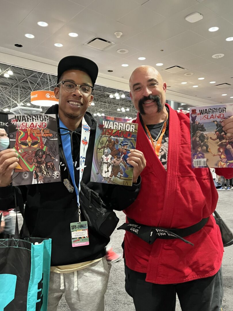 Fans holding Warrior Island comics at Comic Con