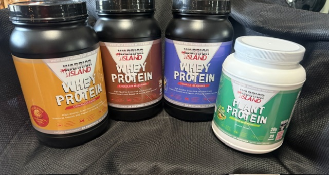 Warrior Island supplement lineup — Whey Protein in Cinnamon Toast Crunch, Chocolate Milkshake, and Vanilla Milkshake, plus Plant Protein